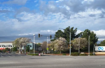 Entrance sign reading Meta, 1 Hacker Way, at Meta's Menlo Park headquarters campus