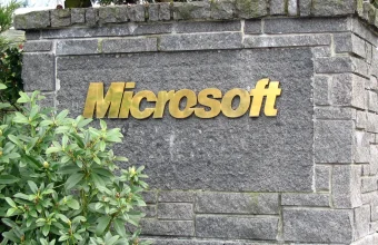 Stone entrance sign with the Microsoft logo in gold lettering at the company's Redmond campus