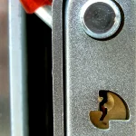 Close-up of a padlock and chain locking mechanism, representing verifying npm package integrity to block supply chain compromises