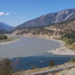 The muddy Fraser River meeting the blue-green Thompson River at their confluence near Lytton, British Columbia