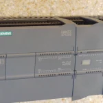 Siemens SIMATIC S7-1200 programmable logic controller with expansion modules, the type of device named in the CISA advisory