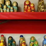 Rows of Russian nesting dolls of decreasing size on display, a visual metaphor for one SQL query nested inside another