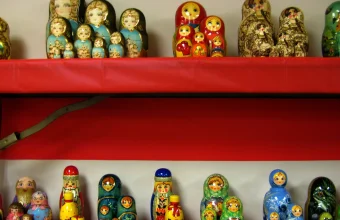 Rows of Russian nesting dolls of decreasing size on display, a visual metaphor for one SQL query nested inside another