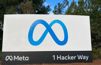 Meta headquarters entrance sign reading 1 Hacker Way with the Meta logo, in Menlo Park, California