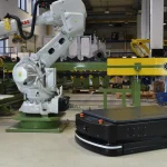 Canonical’s Zenoh Snaps Turn ROS 2’s Middleware Fix Into a Packaging Decision An ABB industrial robot arm and a black mobile AGV robot standing together on a factory floor