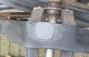 A round rubber patch applied to a punctured bicycle inner tube