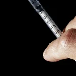 CISA Orders Federal Agencies to Patch an Actively Exploited Cisco Email Gateway Flaw by September 17 A hand holds a hypodermic syringe with visible dosage markings against a black background, illustrating a SQL injection vulnerability
