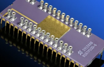 Macro photo of a ceramic microcontroller chip with an exposed gold die, representing embedded device security