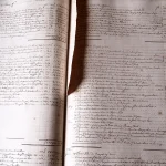 An open 18th-century accounting ledger book showing handwritten rows and columns of numbers in ink
