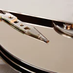How to Build a Changed Block Tracking System in Python to Speed Up Incremental Backups Macro photo of an open hard disk drive showing the read-write head suspended just above a reflective platter
