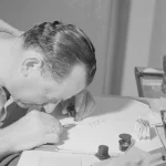 A jeweler examining diamonds through a loupe while sorting them on a desk in 1964