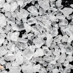 Macro photo of coarse sea salt crystals, a visual metaphor for salting password hashes