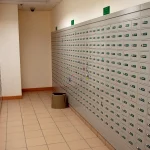 A hallway lined with hundreds of individually numbered post office boxes at a Hong Kong post office