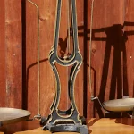 An antique two-pan brass balance scale with matching pans on either side of a central pillar, used as a visual metaphor for comparing two raters' judgments