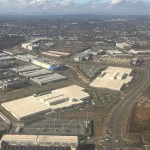 Aerial photo of data center warehouses interspersed with roads and suburban development in Loudoun County, Virginia's Data Center Alley