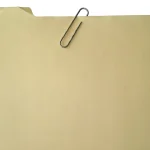 CISA Orders Federal Agencies to Patch a SharePoint RCE Flaw Microsoft First Called Spoofing A manila file folder with a paperclip clipped to its tab, against a white background