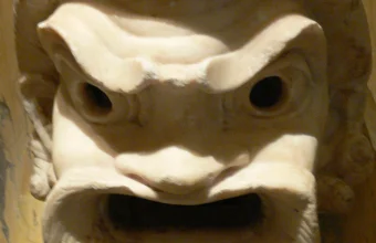 Ancient marble theatrical comedy mask with a fierce, staring expression, a literal visual metaphor for a persona file swapped onto an unchanged framework