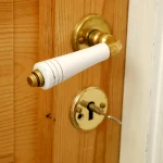 TU Graz’s File Notification Attacks Turn a Decades-Old OS Feature Into a Side Channel Macro photo of a brass keyhole with a key partially inserted in a wooden door