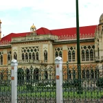 Government House of Thailand, an ornate Venetian Gothic building in Bangkok with a red tile roof and gilded domes, home to the Prime Minister's Office