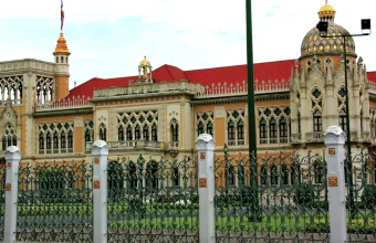 Government House of Thailand, an ornate Venetian Gothic building in Bangkok with a red tile roof and gilded domes, home to the Prime Minister's Office