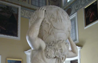 Marble statue of the Titan Atlas straining beneath the carved celestial sphere on his shoulders, the figure Atlassian is named after