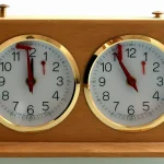 A CNCF Post on NIS2 and DORA Turns Compliance Into a Backlog and Leaves the Classification Call Unowned Wooden two-dial chess clock with brass-rimmed white faces showing different times