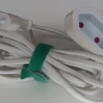 Cursor’s Marketplace Served a Tampered Claude Code Extension With an SSH Backdoor for 11 Hours, and Its Notice Now Names Two Versions Instead of One A white extension cord with a Europlug at one end and a socket at the other, coiled and held together by a green strap