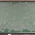 How to Prevent Lost Updates in a FastAPI API With ETag and If-Match A green classroom chalkboard wiped almost clean, with pale smears of chalk where earlier writing was erased