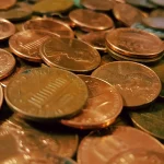 Close-up photo of a pile of copper one-cent coins