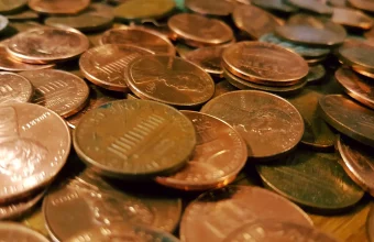 Close-up photo of a pile of copper one-cent coins