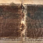 Two opened leaves of the Verona palimpsest, with an older, darker layer of writing still showing through the newer script written over it