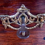 How to Add Passkey Login to a FastAPI App With WebAuthn and Block Replay, Wrong-Origin, and Account-Takeover Bugs Brass decorative keyhole plate on a wooden drawer with a key inserted in the lock