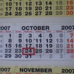A wall calendar showing October 2007 with the 24th boxed in red and the start of November below it