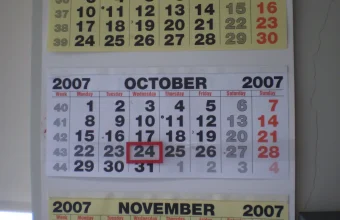 A wall calendar showing October 2007 with the 24th boxed in red and the start of November below it