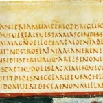 Seven lines of Latin verse in capital letters with no spaces between the words, from a late antique manuscript of Virgil